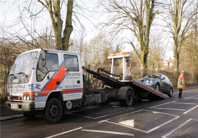Bushey Hall Garage recovery truck collecting a damaged vehicle